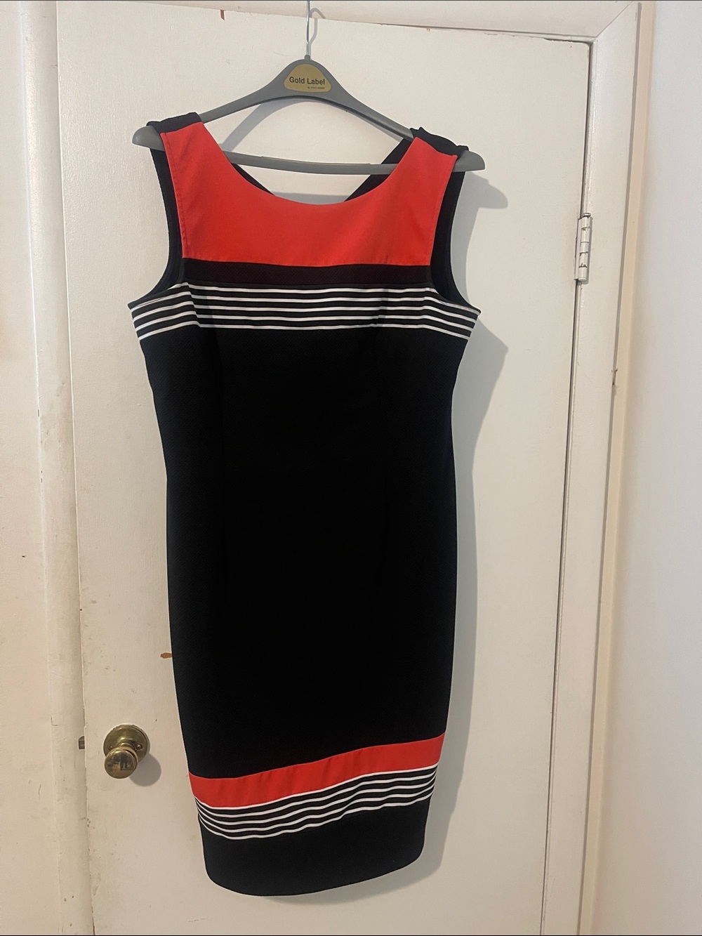 Sleeveless Black Midi Dress with Red Accent and White Stripes